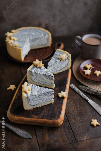 Delicious cottage cheese poppy-seed cake made of shortcrust pastry decorated with biscuits. Cheesecake with different beautiful layers. Easy Sweets Recipes