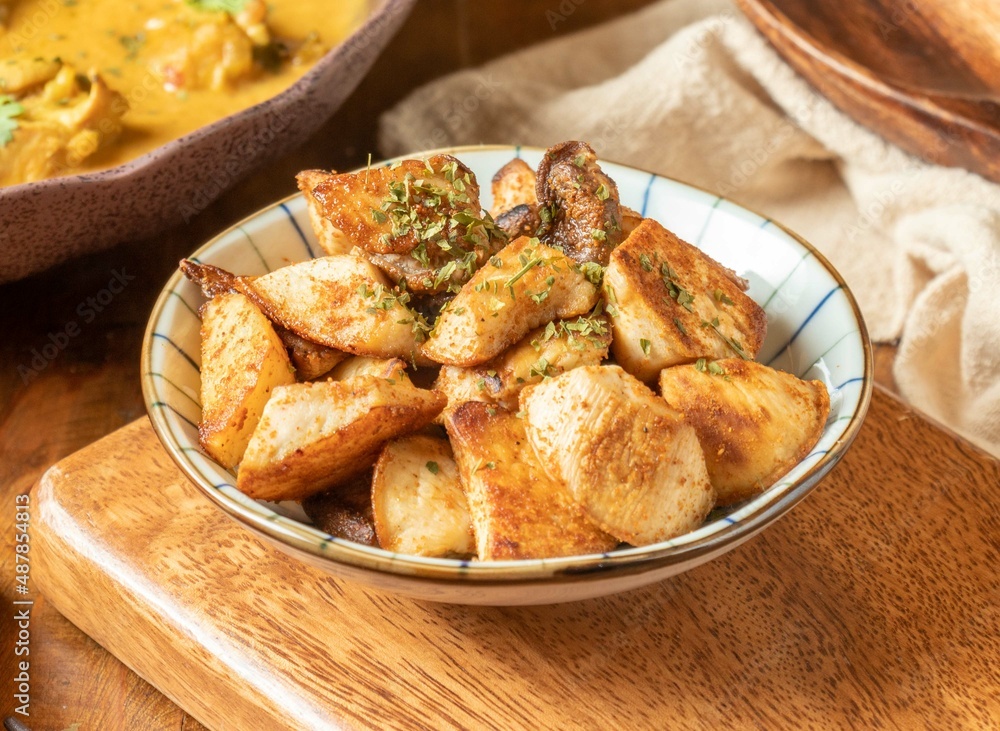 Stir-fried Mushrooms with Mixed Spices in a dish on wooden background top view Stir-fried Mushrooms with Mixed Spices in a dish on wooden background top view