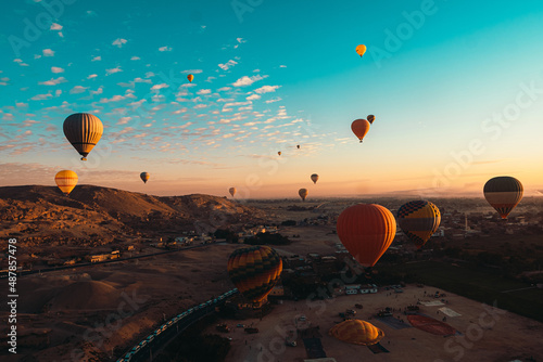 Amazing wide view of many balloons during takeoff in luxor egypt. Early morning hours as hot air balloons fill the sky