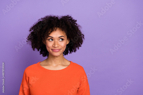 Photo of nice millennial brunette lady look ad wear orange t-shirt isolated on purple background.