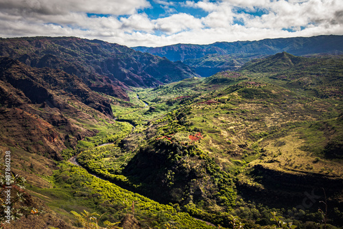 Kokee Road Overlook showing a beautiful lanscape with a valley and river in Kauai, HI. 