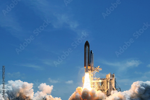Fototapeta Naklejka Na Ścianę i Meble -  Take off space rocket on a background of blue sky and sun. Elements of this image were furnished by NASA