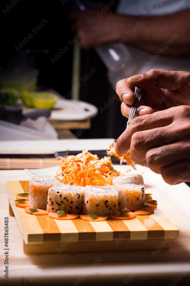 Making sushi. Japanese chef. Japanese role preparation