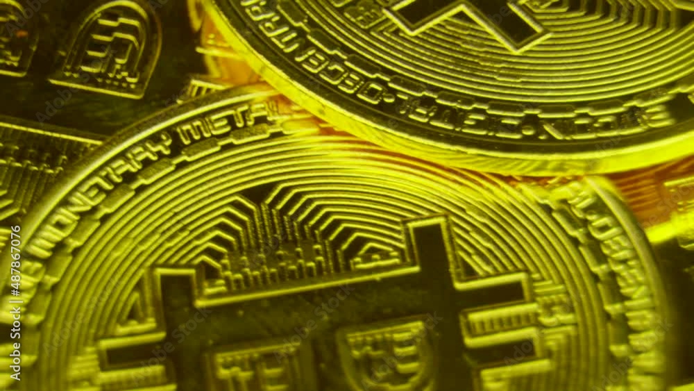 Golden coins spin and shine. Bitcoin BTC virtual money produced by blockchain technology Golden coins spin and shine. Bitcoin BTC virtual money produced by blockchain technology