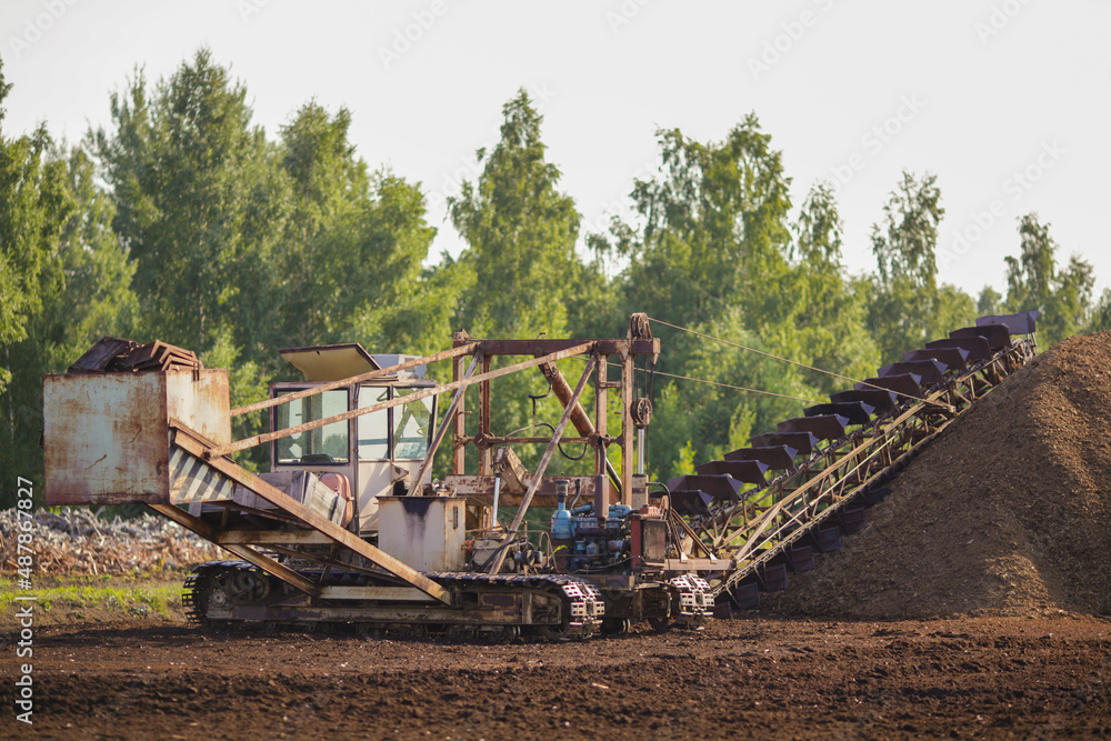 Fototapeta premium Special machine for peat extraction, raised bog