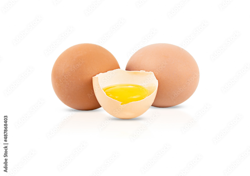One broken egg and two whole eggs isolated on a white background One broken egg and two whole eggs isolated on a white background