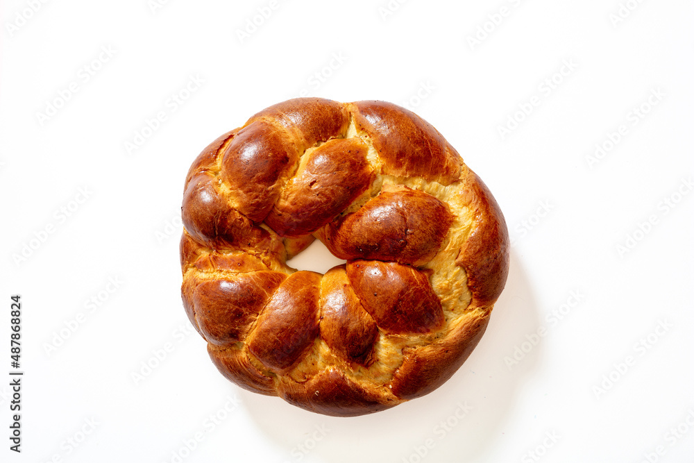 Easter greek tsoureki braid, sweet bread brioche overhead isolated on white Easter greek tsoureki braid, sweet bread brioche overhead isolated on white