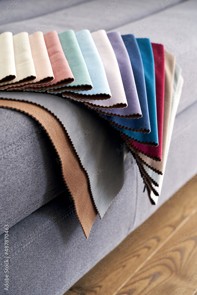 Colorful upholstery fabric samples on the home sofa