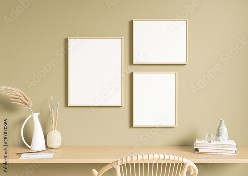 Three 8x10 vertical and horizontal boho style wooden frame mockup with chair and desk. Wooden frame mockup on olive green wall with vase. 3D Rendering.