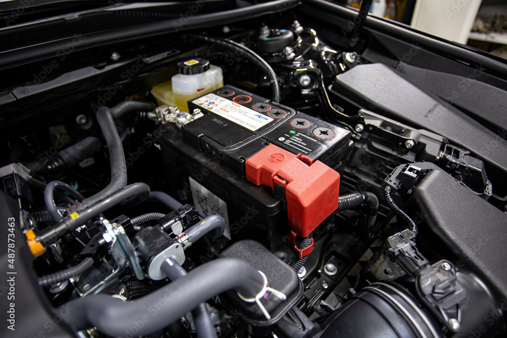 car battery under the hood of the car