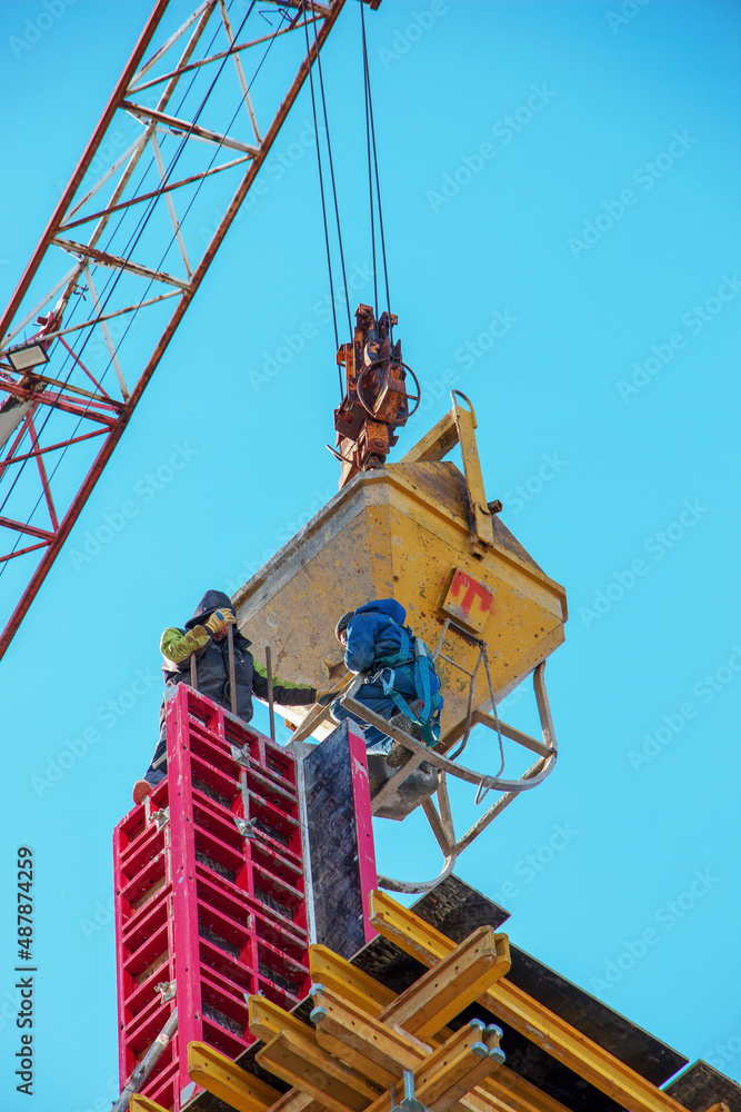 Fototapeta premium Construction formwork, reinforcement for the construction of buildings. Workers make a concrete structure