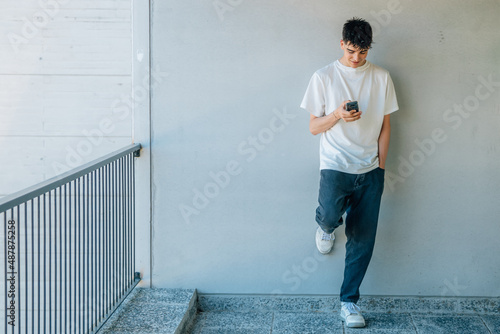 teen boy with mobile phone © carballo