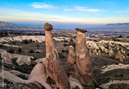 Three Graces in Cappadocia, Nevsehir, Turkey. Fairy chimneys. Turkish name is "Üç Güzeller". Selectively focused on Three Graces.
