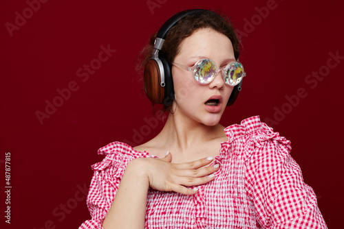 pretty woman diamond glasses headphones music red background unaltered
