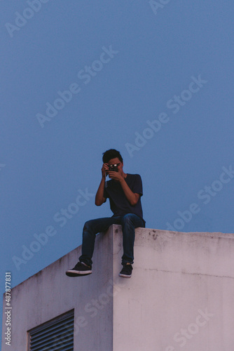 Person siting rooftop