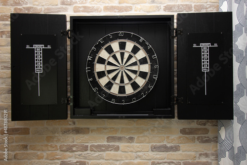 Wall Hung Dart Board Cabinet With Doors For Keeping Score photo