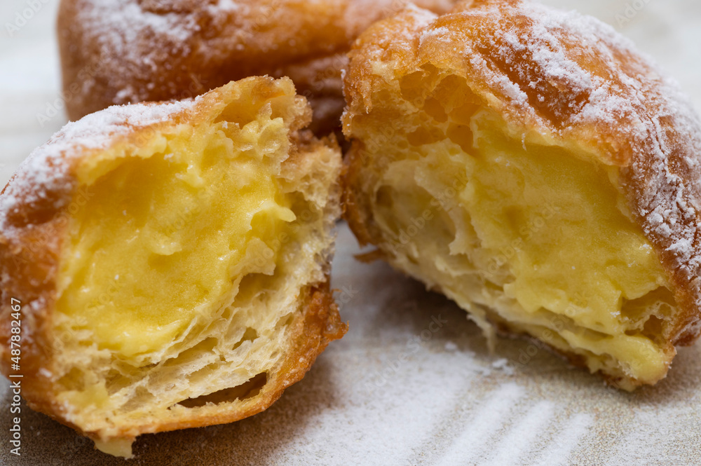 Two cream carnival pancakes or carnival fritters, italian traditional sweet Two cream carnival pancakes or carnival fritters, italian traditional sweet