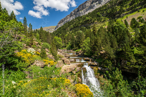 Waterfalls of the river Ara in the Ordesa valley on a sunny day.