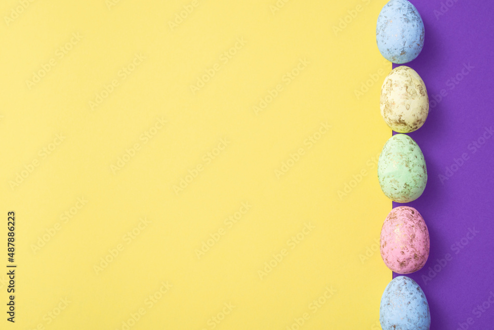 Easter eggs on a colored background. Festive banner with copyspace Easter eggs on a colored background. Festive banner with copyspace