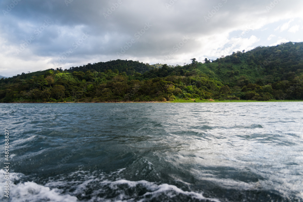 Mountain views from a boat on a lake in Costa Rica. 