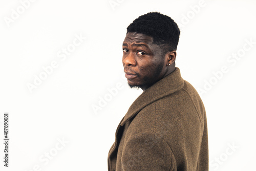 doubtful black man raising his eyebrow white background - close-up shot. High-quality photo photo