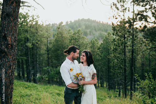 Couple looks into each other’s eyes during elopement photo
