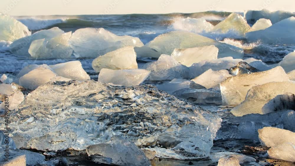 Diamond beach in Iceland, Chunks of pure ice on black sand at Sunrise Diamond beach in Iceland, Chunks of pure ice on black sand at Sunrise