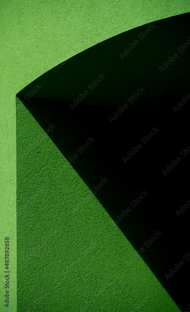 View of geometrical shapes and angles from shadows cast on exterior cement ...