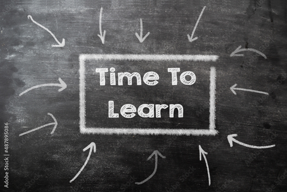 Chalk text on black chalkboard with arrows time to learn. The concept of the importance of learning. Business concept. Chalk text on black chalkboard with arrows time to learn. The concept of the importance of learning. Business concept.