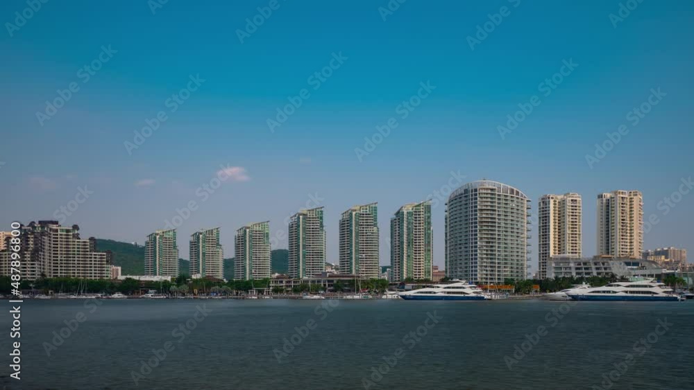 sunny day sanya city apartment complex riverside panorama timelapse 4k hainan island china sunny day sanya city apartment complex riverside panorama timelapse 4k hainan island china