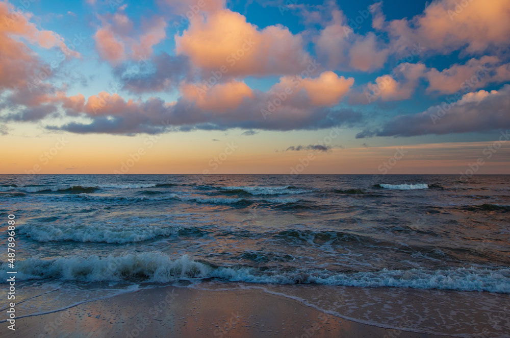 Sunrise Baltic Sea Mielno with colorful storm clouds