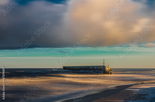 Sunrise Baltic Sea Mielno with colorful storm clouds breakwater long exposure © zmarcin
