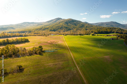 Aerial Drone View of Farm with Trees in the Background with Red Buildings in Virginia