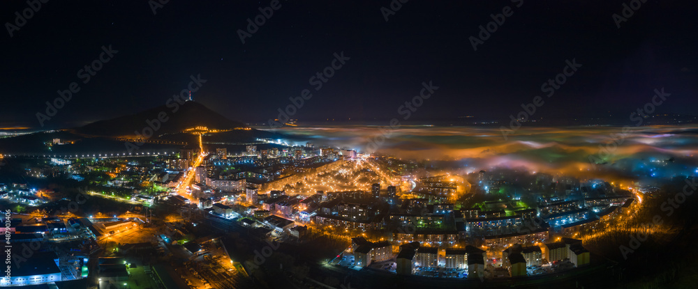 Low clouds and fog in the night city. Location: Pyatigorsk. Stavropol region