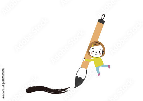 毛筆の筆を書いている笑顔の女の子