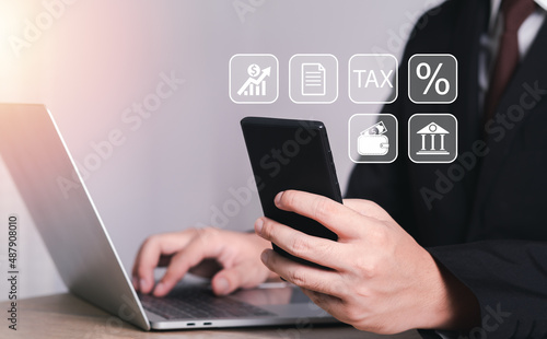 businessman is using a credit card with a smartphone for financial transactions. purchase product on internet with icon Online banking and online shopping. Convenience in the world of technology.