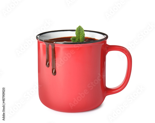 Mug of delicious hot chocolate with fresh mint leaves isolated on white