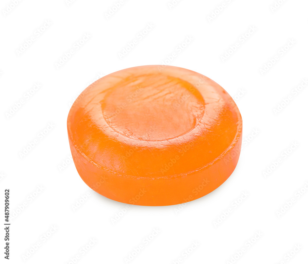 One orange cough drop isolated on white One orange cough drop isolated on white