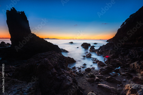 orange sunset on the beach with waves in Pulau Mawar, Mersing, Johor, Malaysia