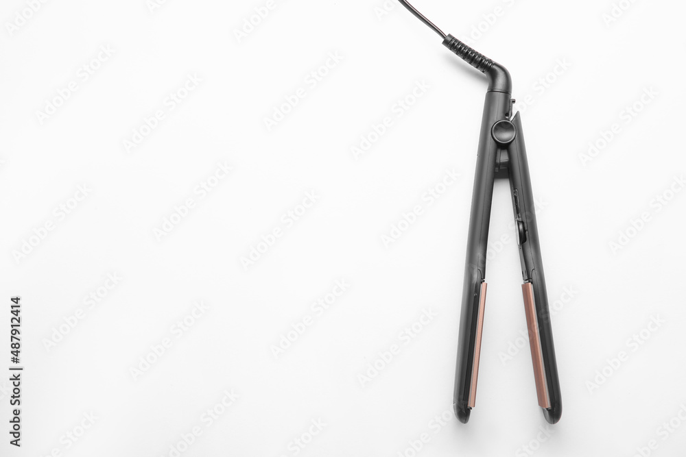 Modern corrugated hair iron isolated on white, top view Modern corrugated hair iron isolated on white, top view