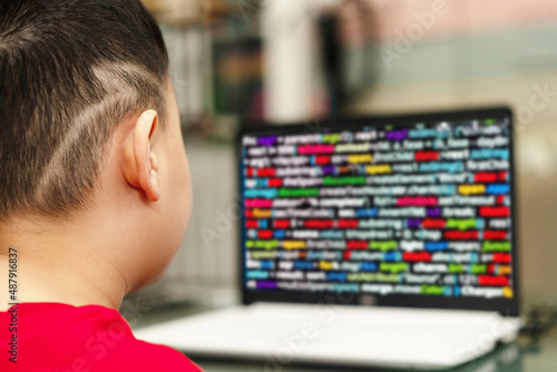 child is typing keyboard computer for internet education technology and learning coding for kid