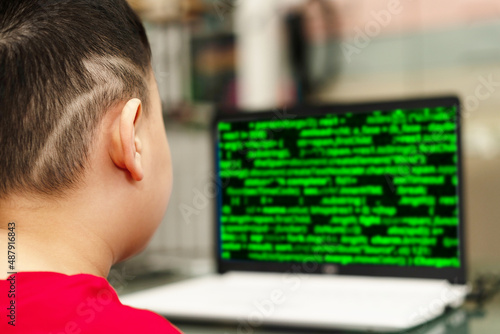 child is typing keyboard computer for internet education technology and learning