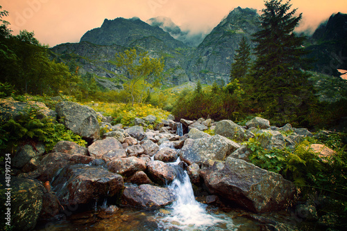 River in foggy mountains landscape. © Anioł