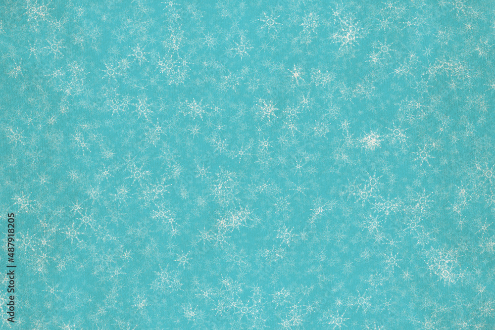 Obraz premium snowflakes on old paper texture
