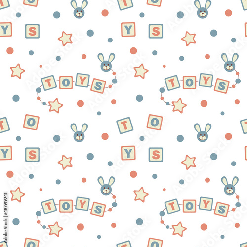 Vector seamless pattern with a kids blocks toys and letters. Tender childish wallpaper.