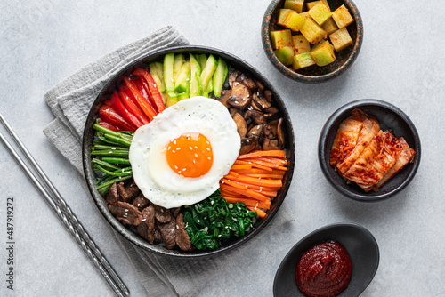  Bibimbap on a concrete background, traditional korean dish, top view