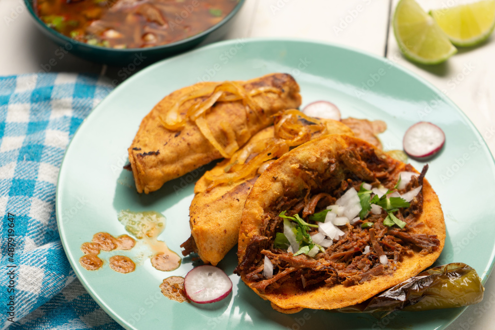 Beef birria tacos with sauce. Mexican food Beef birria tacos with sauce. Mexican food
