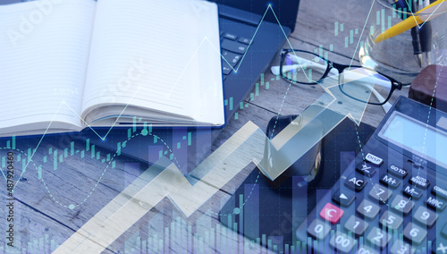 Businessman using computer analyzing sales data and economic growth graph chart. Business planning and strategy. Analysing trading of exchange. Financial and banking. double exposure 