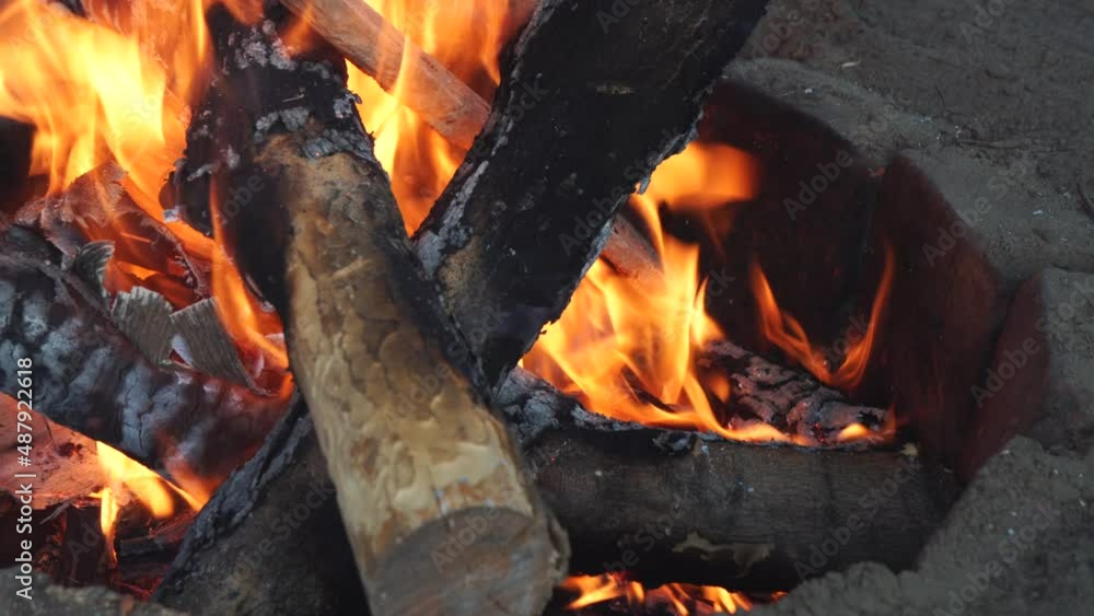 Smoldering embers on blurred background. Camping and fire safety concept. Smoldering embers on blurred background. Camping and fire safety concept.