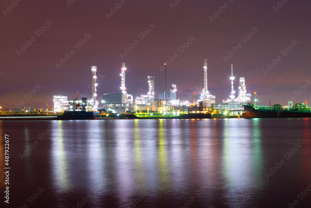 Oil refinery industry at sunset - factory - petrochemical plant